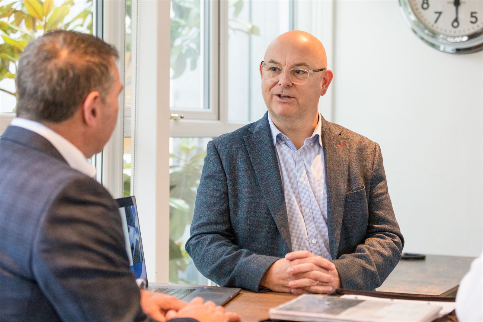 Rob Douglass in a strategy discussion with two business owners