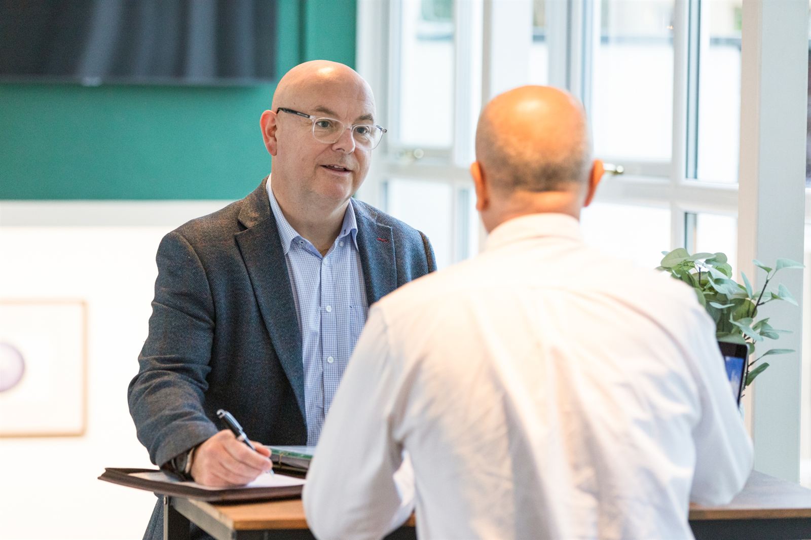 Rob Douglass in conversation with a business owner